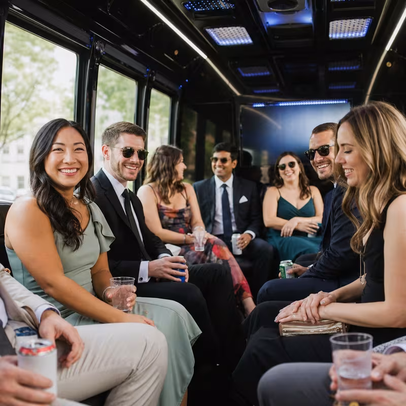 Wedding guests seated inside a Washington party bus