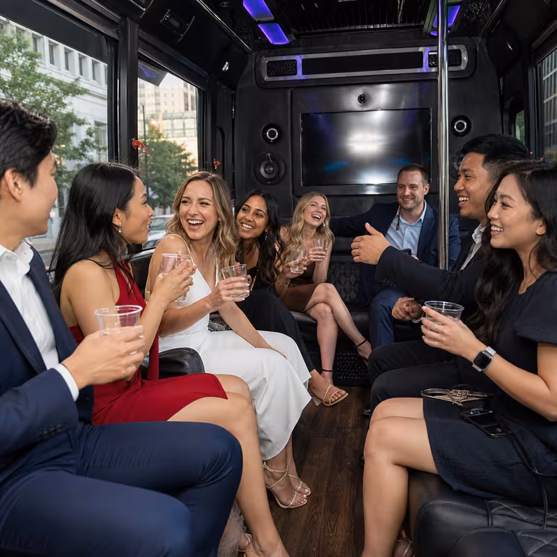 Party bus interior with wraparound leather seating and LED lighting in Washington