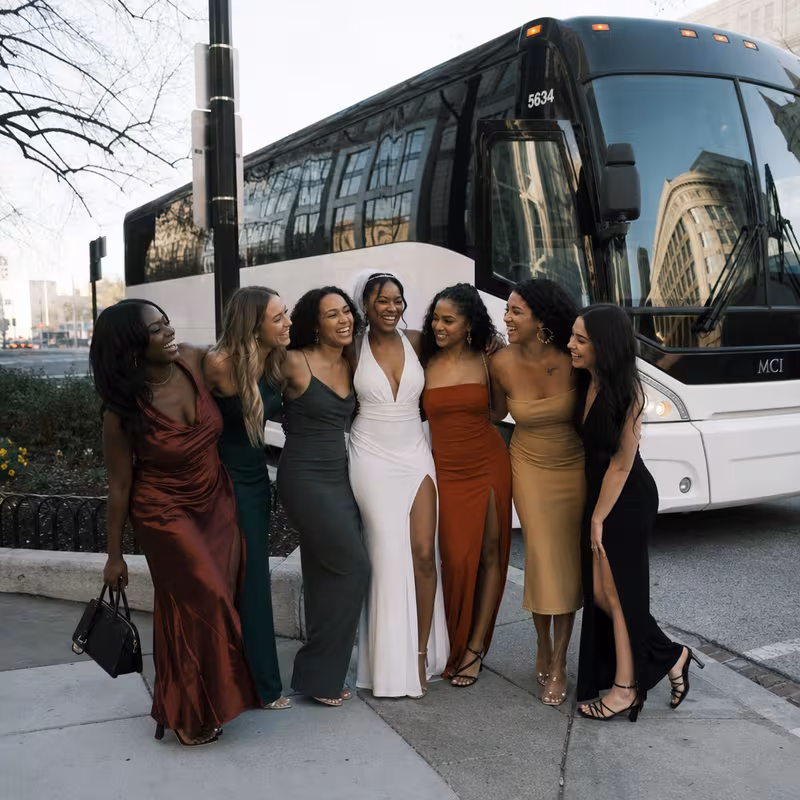 Passengers loading luggage while boarding an Washington group shuttle