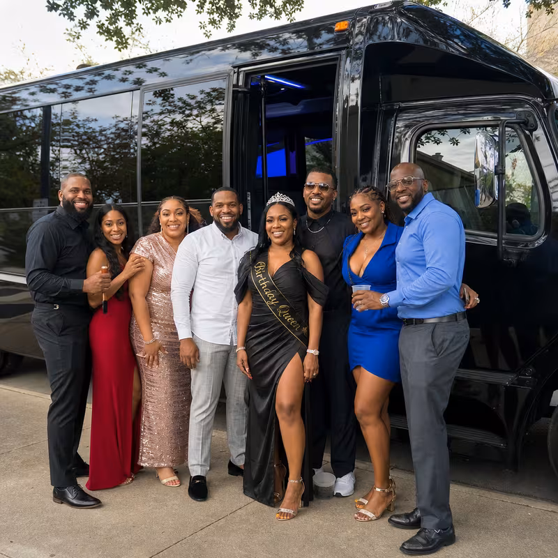Group boarding a white charter bus for Birthday Transportation transportation in Washington