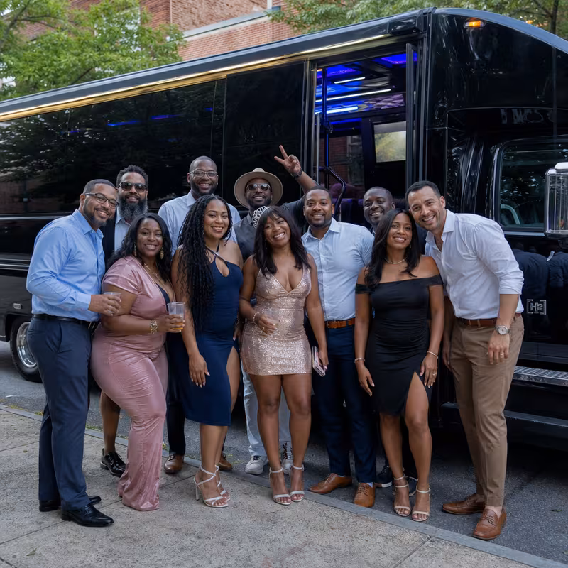 Party bus interior with wraparound leather seating and LED lighting in Washington