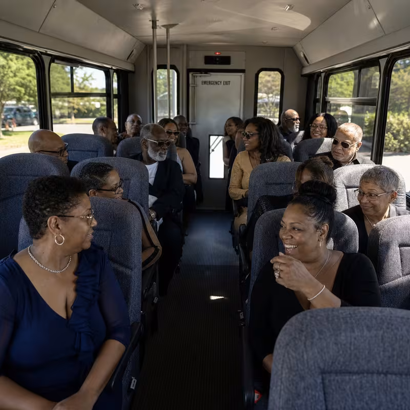 Group boarding a white charter bus for Private Event Transportation transportation in Washington