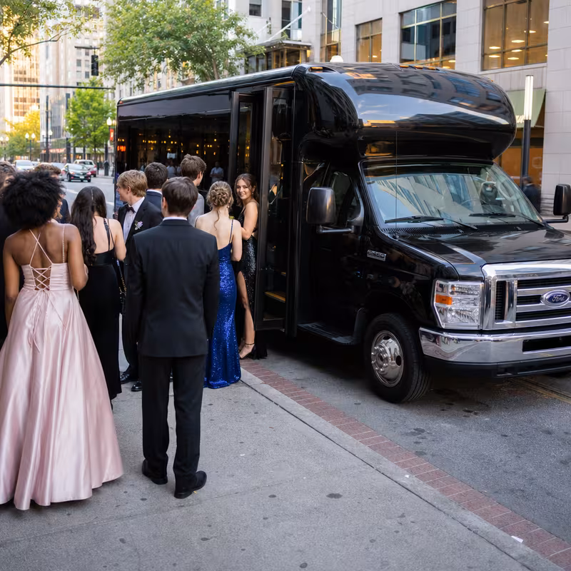 Passengers loading luggage while boarding an Washington group shuttle