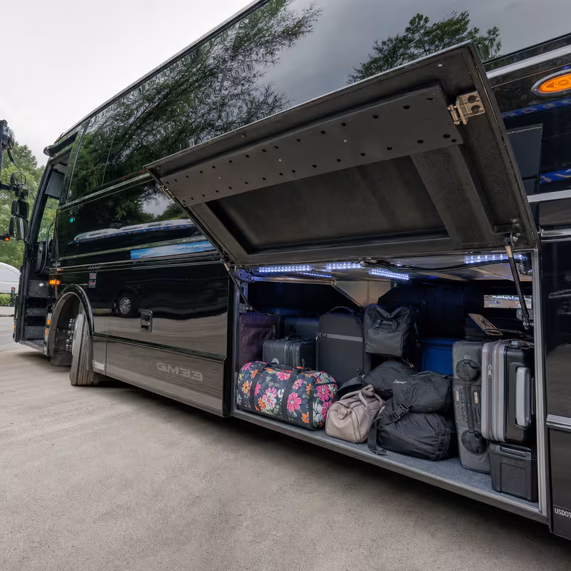 Party bus interior with wraparound leather seating and LED lighting in Washington