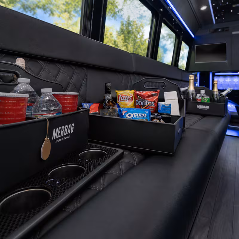 Party bus interior with wraparound leather seating and LED lighting in Washington