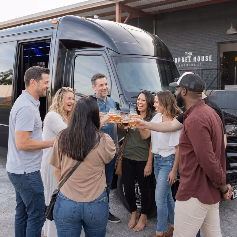 Passengers loading luggage while boarding an Washington group shuttle